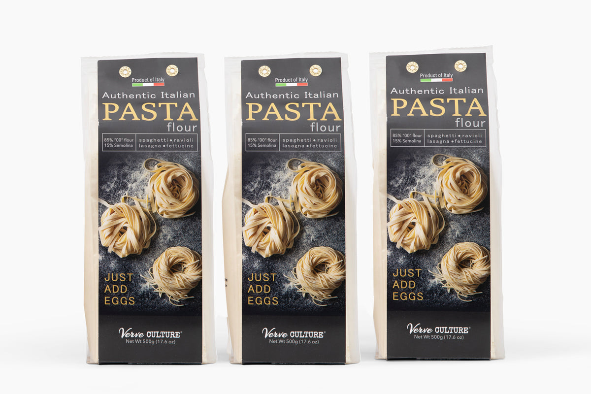 Three packages of Authentic Italian Pasta Flour with "00" type flour and dried pasta nests displayed on black and cream label