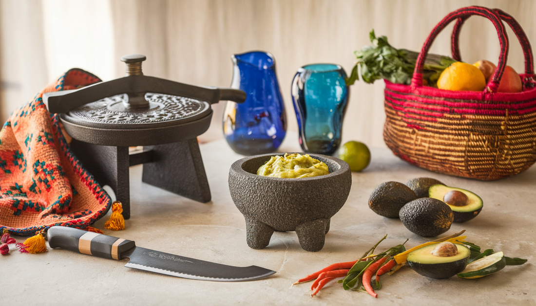 A traditional kitchen scene featuring a cast iron tortilla press, a handwoven servilleta, a Thai Chef's Moon Knife, handblown Mexican glassware, a Molcajete with guacamole, and a Moroccan basket with produce, all softly lit to highlight craftsmanship.