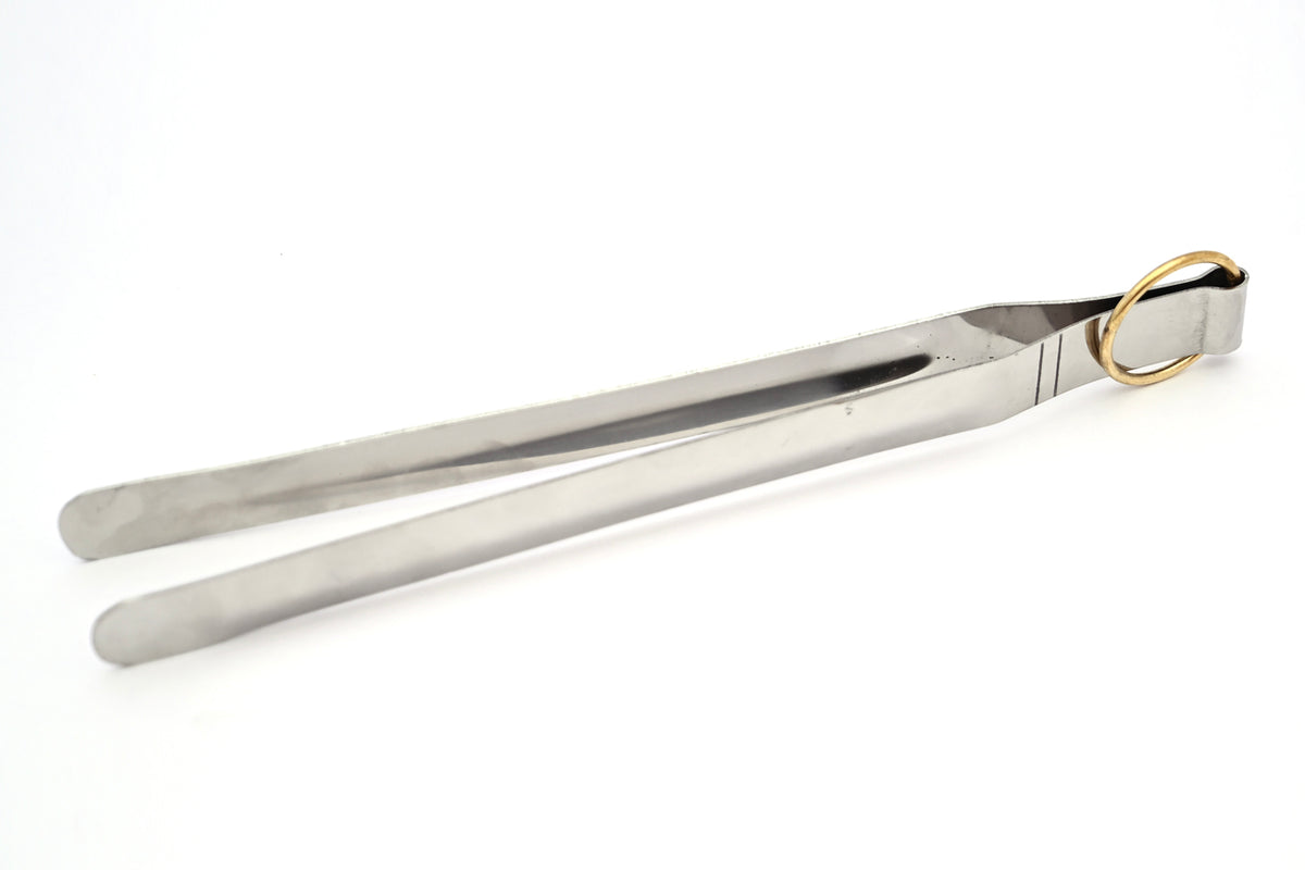 Stainless steel tongs with two handles and a brass ring connector at the top.