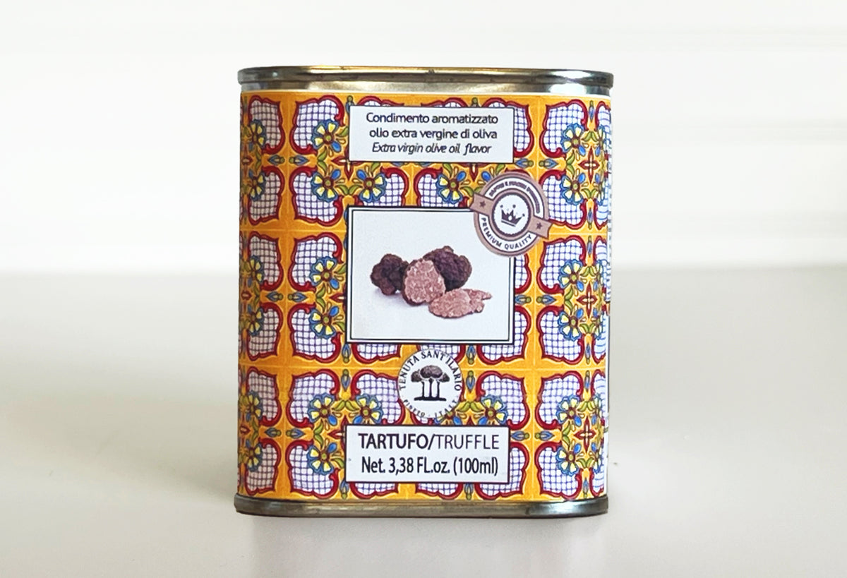 Small tin can with colorful geometric label featuring truffles, labeled truffle-infused extra virgin olive oil, 100ml.