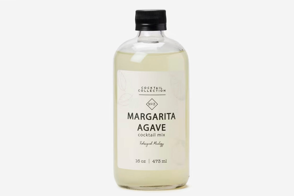 Clear glass bottle with black cap containing pale yellow liquid labeled "Margarita Agave" cocktail mix, 16 oz.