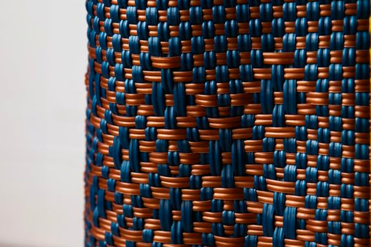 Woven tote bag with blue and orange striped textile pattern in tight geometric weave.