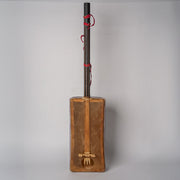 Wooden gimbri with dark neck, red tuning pegs, and rectangular resonance chamber against white background.