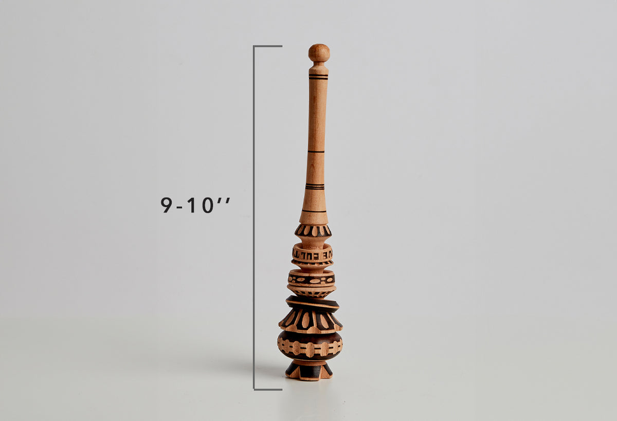 Wooden molinillo whisk with hand-carved bulbous base and cylindrical handle, 9-10 inches tall.