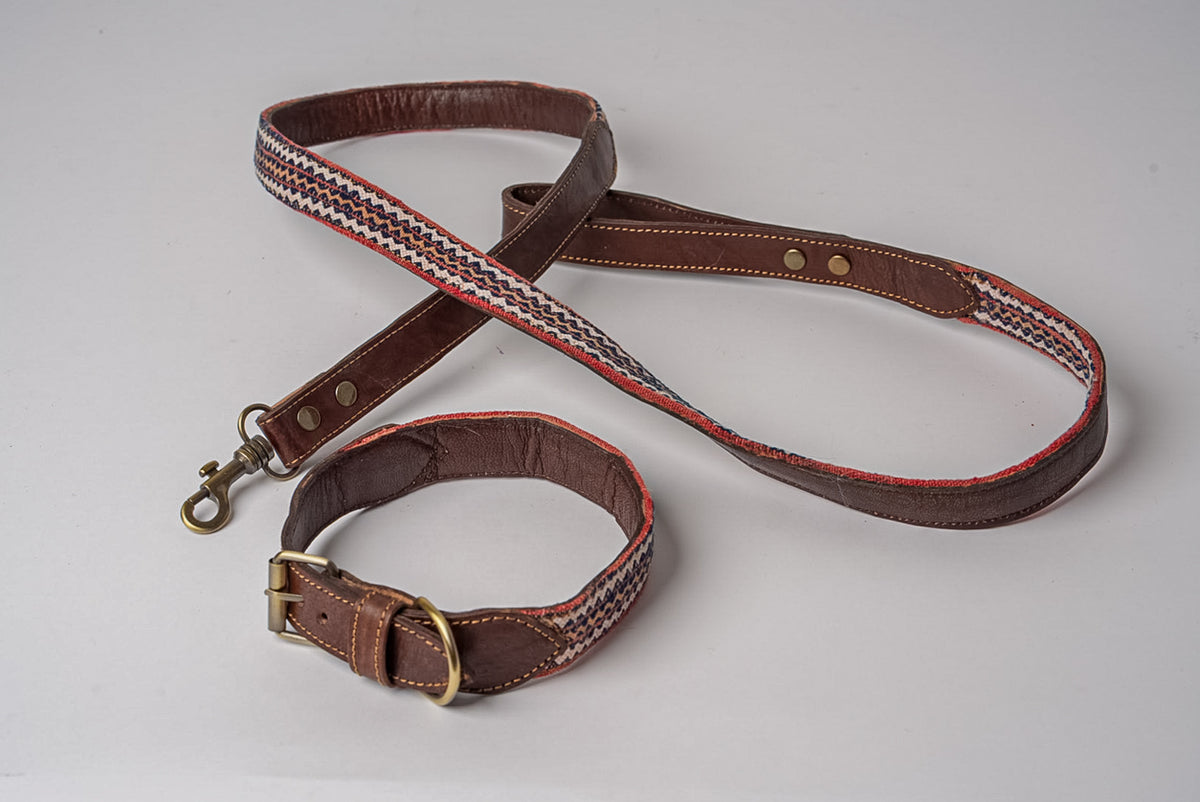 Brown leather collar with geometric woven fabric stripe and matching leash with brass hardware.