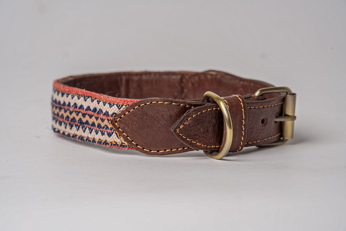 Brown leather dog collar with geometric patterned fabric panel, brass buckle and D-ring.