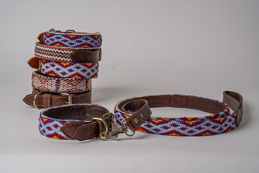 Stacked collars with geometric woven patterns in blue, red, and yellow with brown leather trim, and matching leash with metal