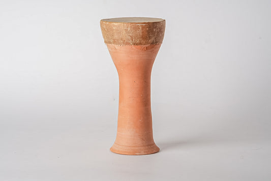 Terracotta goblet-shaped drum with narrow cylindrical body, wider top rim, and textured brown surface.