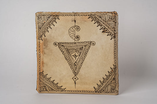 Square Moroccan drum with natural leather surface featuring geometric and ornamental line designs in brown ink.