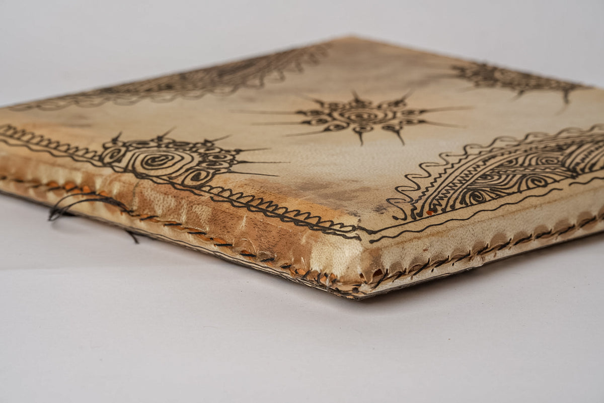 Square drum with natural skin head featuring hand-drawn geometric and floral patterns in black ink.