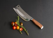 Thai chef's knife with wide rectangular blade, wooden handle, and hole at top, displayed with fresh tomatoes and rosemary spr