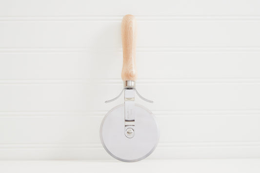 Wooden-handled pizza slicer with circular metal cutting wheel and stainless steel handle supports.