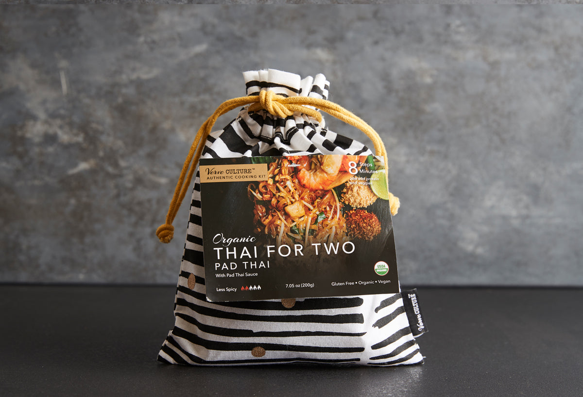 Organic Thai for Two Pad Thai meal kit in black and white striped drawstring pouch with product label showing noodle dish ima