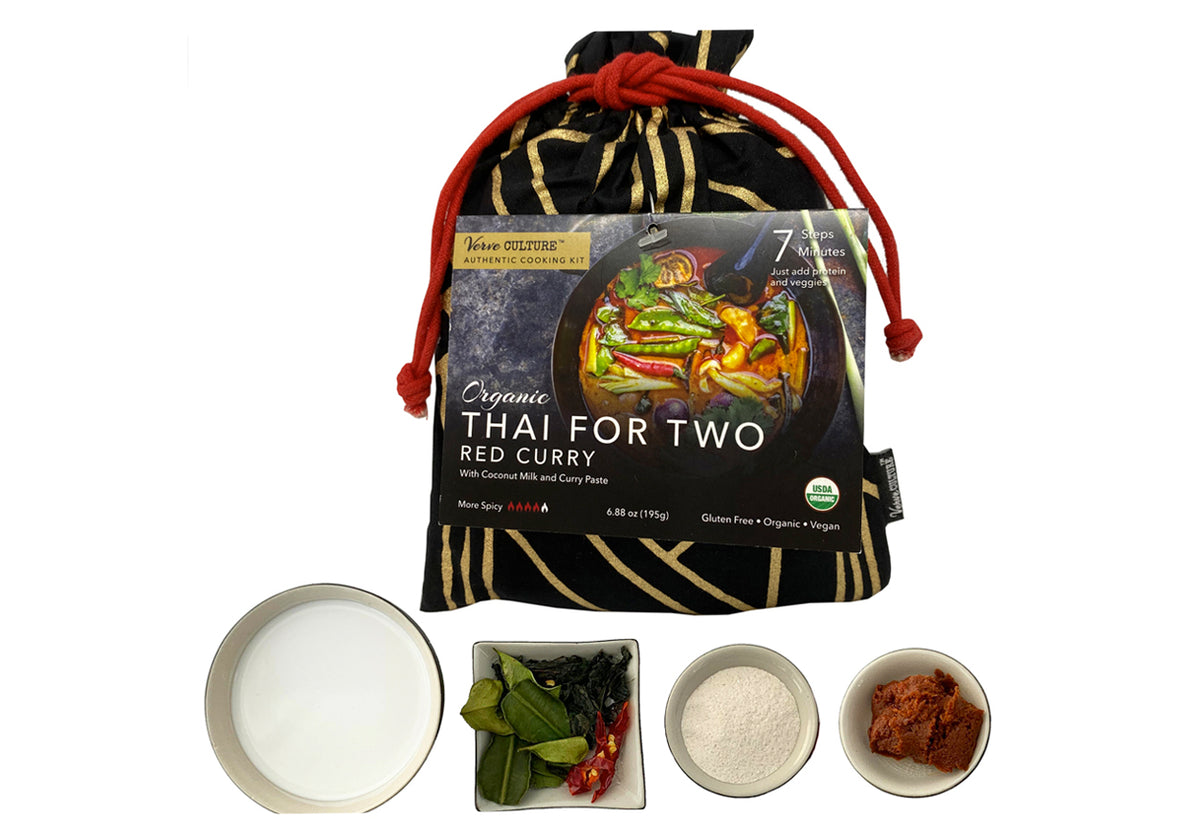Thai for Two Organic Red Curry Kit with black drawstring pouch, coconut milk, fresh basil, rice, and red curry paste in bowls